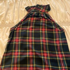 Multicolored pattern sleeveless top with tie back.